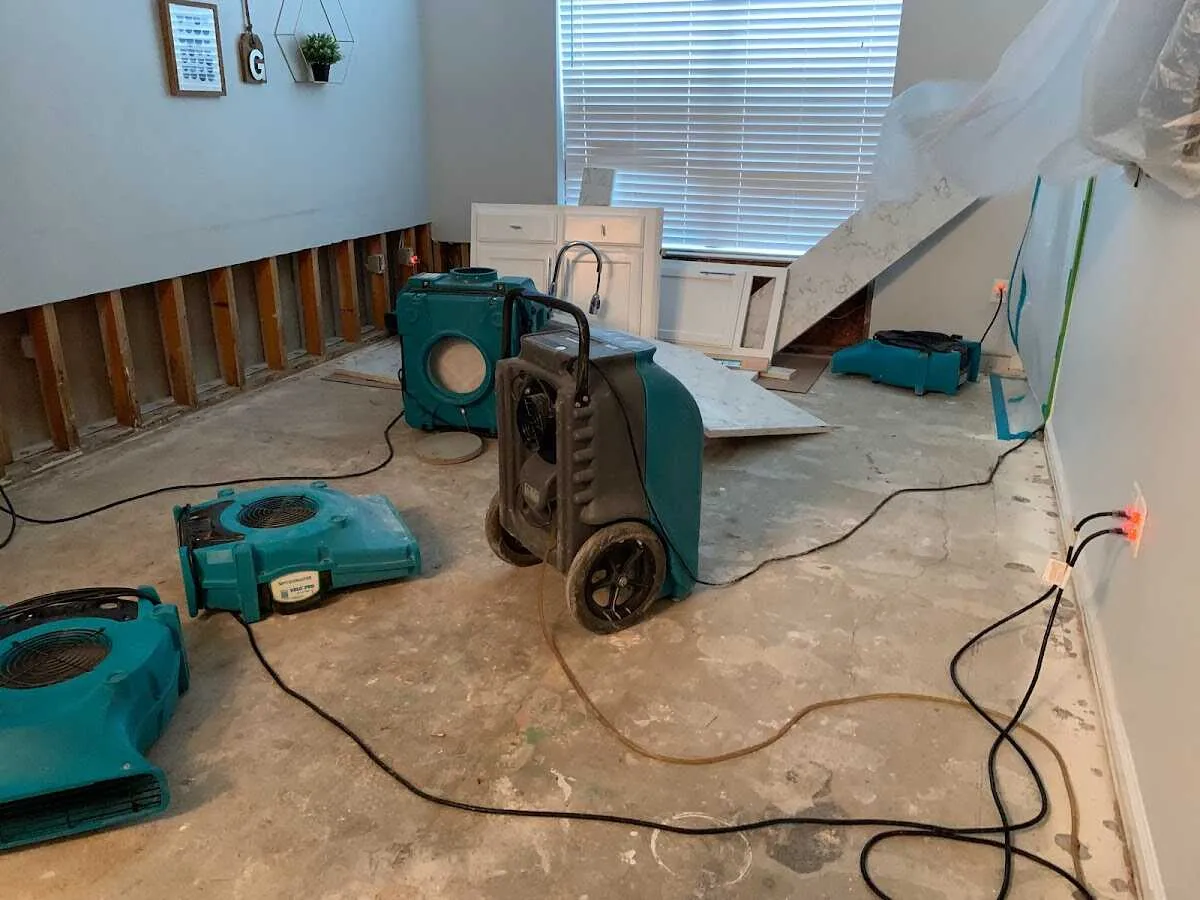Dehumidifier in flood-cut room for Water Damage Restoration in Corinth